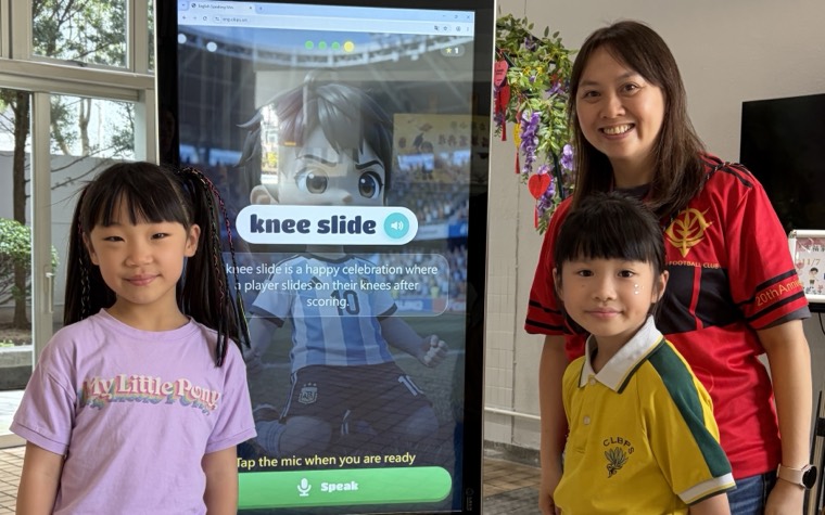 Speak to Watch: a student reading vocabulary aloud at the large screen
